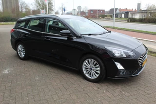 Ford Focus Ford Focus Wagon 1.0-125pk EcoBoost Mild-hybrid Titanium. Mooie, ruime, luxe en comfortabele Ford Focus wagon ! Volautm. airco dual, camera, stoel-, stuur- en voorraamverw., easy entry/easy go, cruise control, Isofix, side- en lane assist, parkeersensoren v+a, LM wielen etc. - afbeelding nr 45