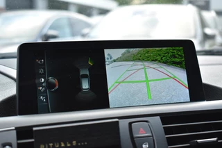 BMW 1 Serie BMW 1-serie M140i xDrive High Executive Pano Camera H/K Leder Elekstoel - afbeelding nr 24
