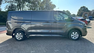 Ford Transit Custom Ford Transit Custom 320 2.0 TDCI L2H1 Trend | SCI | Automaat 136pk | Adaptive cruise control | Dubbele schuifdeur | 8-weg bestuurderstoel + passagiersstoel | Stoelverwarming | Dodehoeksensoren | Navigatie | Elektrische inklapbare spiegels | 16 inch lichtmetalen velgen | Full LED | Dual-zone climate control | LED laadruimteverlichting - afbeelding nr 2