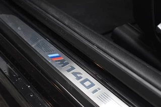 BMW 1 Serie BMW 1-serie M140i xDrive High Executive Pano Camera H/K Leder Elekstoel - afbeelding nr 13