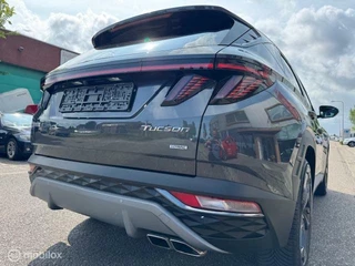 Hyundai Tucson Hyundai Tucson 1.6 T MHEV BlackLine 4WD Automaat , Trekhaak 1.650kg Trekgewicht ,  Panorama Dak , Stoel & Stuur verwarming ,  Navigatie & Camera , Parkeerhulp voor & achter, Keyless entry , Electr Achter klep , IQ telefoonlader - afbeelding nr 11