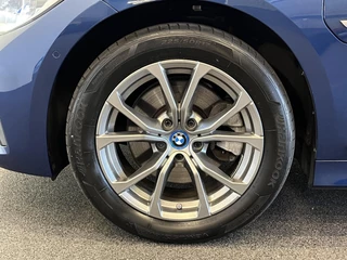 BMW 3 Serie BMW 3-serie Touring 320e Sportline Aut-8 Panoramadak HUD Laser Licht Adaptive Cruise Trekhaak Leder Navi PDC VA - afbeelding nr 29