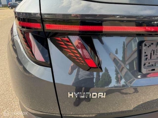 Hyundai Tucson Hyundai Tucson 1.6 T MHEV BlackLine 4WD Automaat , Trekhaak 1.650kg Trekgewicht ,  Panorama Dak , Stoel & Stuur verwarming ,  Navigatie & Camera , Parkeerhulp voor & achter, Keyless entry , Electr Achter klep , IQ telefoonlader - afbeelding nr 10