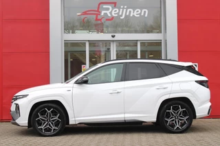 Hyundai Tucson Hyundai Tucson 1.6 T-GDI 266PK PHEV N LINE 4WD | NAVIGATIE | APPLE CARPLAY/ANDROID AUTO | ADAPTIVE CRUISE CONTROL | DODEHOEK DETECTIE | VOOR/ACHTERBANK VERWARMD | CLIMATE CONTROL | FULL LED KOPLAMPEN | ACHTERUITRIJ CAMERA | ELEKTRISCH BEDIENBARE ACHTERKLEP | STUUR VERWARMING | KEYLESS ENTRY/START | 19