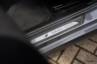 BMW 1 Serie BMW 1-serie M140i LCI2 | Schuifdak | Stuurverwarming | Navi Pro | Alcantara | HiFi Audio| M Sport onderstel | 719M | 5-deurs | - afbeelding nr 35