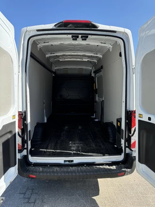 Ford E-Transit Ford E-Transit 350 L2H3 Trend 68 kWh Zuid | 184pk | Pro Power on board | Navigatie | Hoog Dak | Adaptieve Cruise | Digitale binnenspiegel | Keyless entry | Laadruimte bescherming | All season banden | Reservewiel | Perimetrisch alarm - afbeelding nr 7