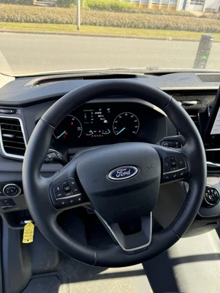 Ford E-Transit Ford E-Transit 350 L2H3 Trend 68 kWh Zuid | 184pk | Pro Power on board | Navigatie | Hoog Dak | Adaptieve Cruise | Digitale binnenspiegel | Keyless entry | Laadruimte bescherming | All season banden | Reservewiel | Perimetrisch alarm - afbeelding nr 12