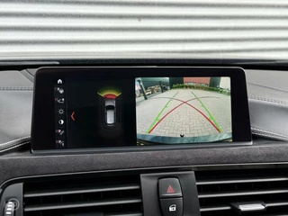 BMW 3 Serie BMW 3-serie Touring 320d High Executive M Sport Panoramadak Trekhaak HUD LED ACC Individual Shadow Line Camera 19