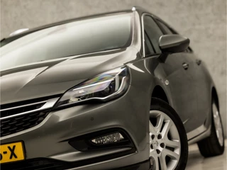 Opel Astra Opel Astra Sports Tourer 1.0 Sportline (APPLE CARPLAY, NAVIGATIE, GETINT GLAS, CHROOM PAKKET, XENON, SPORTSTOELEN, BLUETOOTH, CRUISE CONTROL, NIEUWSTAAT) - afbeelding nr 26