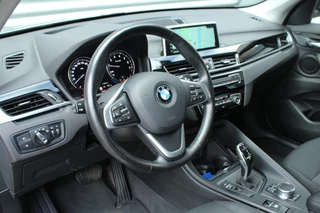 BMW X1 BMW X1 sDrive18i 141pk AUTOMAAT NL-Auto 74.942km Clima Cruise Navi Camera HUD Keyless El. Klep 17
